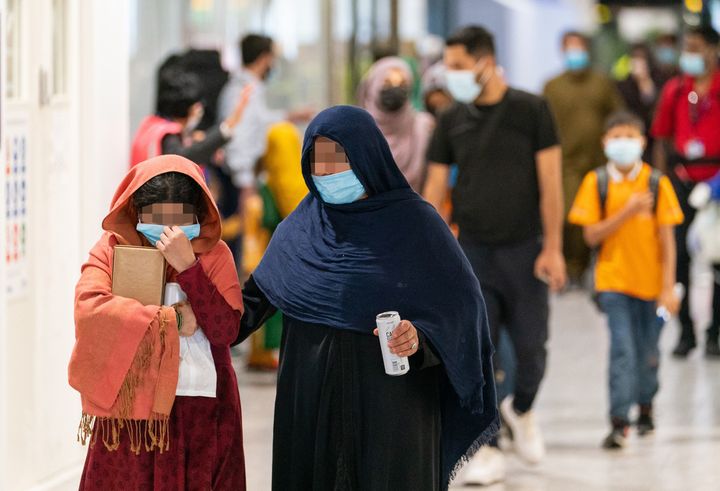 Refugees from Afghanistan arrive on a evacuation flight at Heathrow Airport 