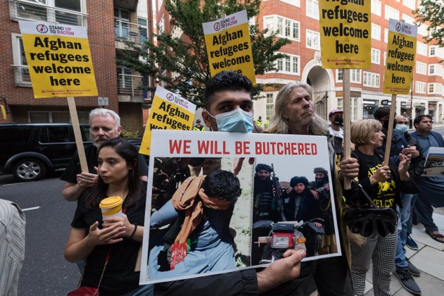 Demonstrators including Afghan people protesting outside the Home Office demanding a safe passage to...