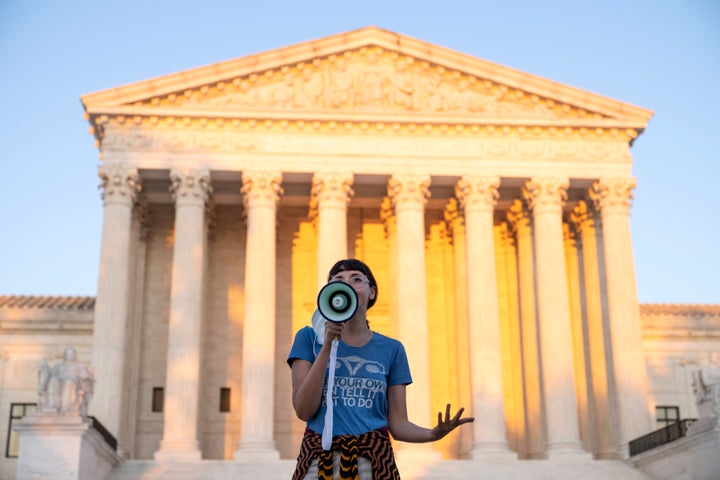 An activist speaks outside the Supreme Court on Sept. 2, 2021, in Washington, D.C., in protest of the new Texas abortion law that prohibits the procedure around six weeks into a pregnancy.