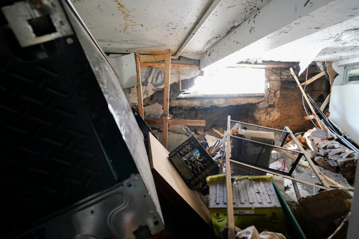 A hole in the foundation where a window once was and flood waters rushed in is seen in the basement apartment on 153rd St. in