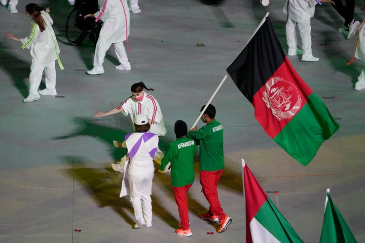 Athletes from Afghanistan march into the stadium during the closing ceremony for the 2020 Paralympics at the National Stadium in Tokyo, Sunday, Sept. 5, 2021. (AP Photo/Eugene Hoshiko)