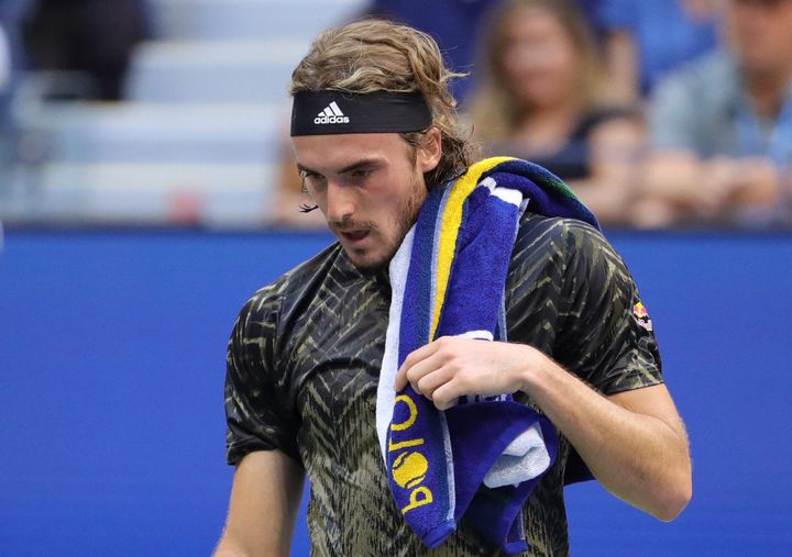 Greece's Stefanos Tsitsipas walks to the other side of the court during his 2021 US Open Tennis tournament men's singles third round match against Spain's Carlos Alcaraz at the USTA Billie Jean King National Tennis Center in New York, on September 3, 2021. (Photo by Kena Betancur / AFP) (Photo by KENA BETANCUR/AFP via Getty Images)