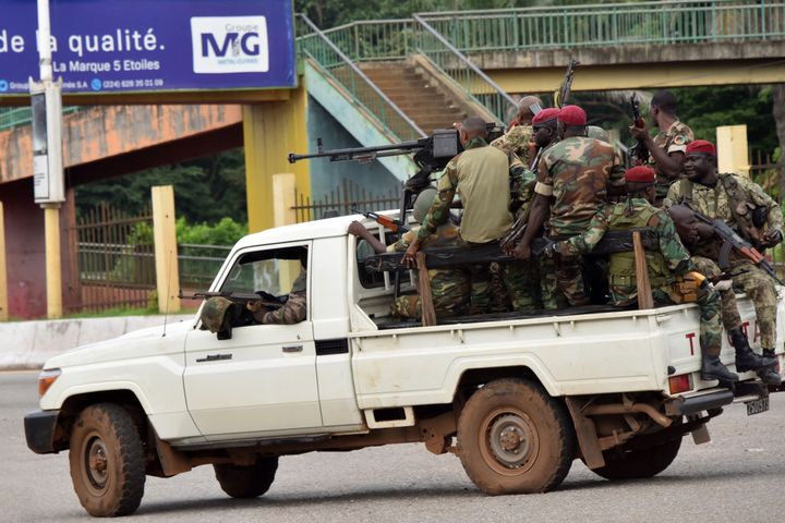 Members of the Armed Forces of Guinea drive through the central neighbourhood of Kaloum in Conakry on September 5, 2021 after sustainable gunfire was heard.
