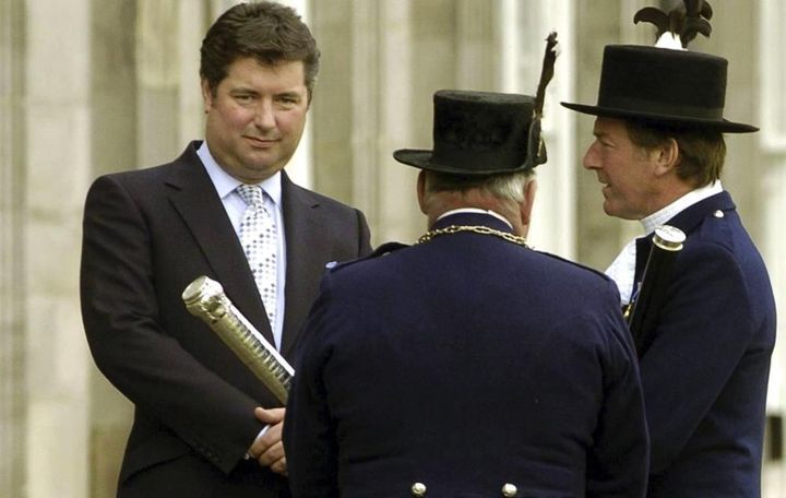 This June 1, 2004 file photo shows Michael Fawcett, left. Fawcett, the former close aide to Britain's Prince Charles stepped down temporarily from his role as chief executive of a royal charity amid reports that he helped secure an honor for a Saudi donor, according to reports Sunday Sept. 5, 2021. 