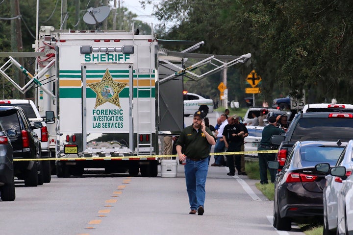 Polk County, Fla., Sheriff's officials work the scene of a multiple fatality shooting Sunday, Sept. 5, 2021, in Lakeland, Florida.