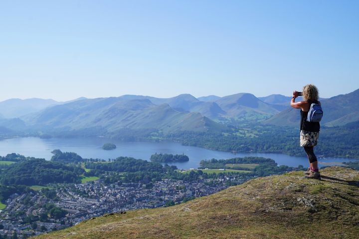 A walker takes in the view of Derwent Water in Cumbria.