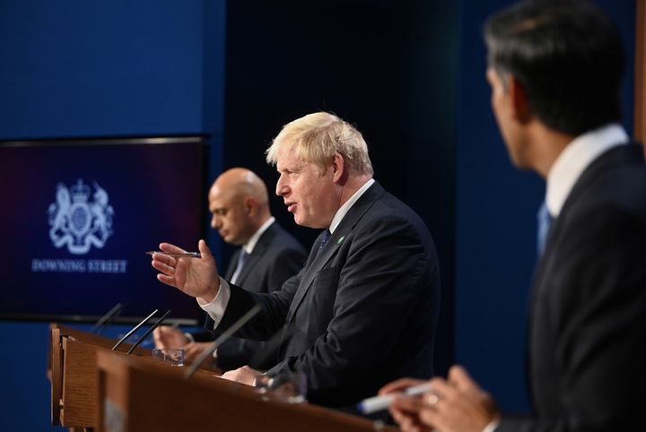 Javid (L), prime minister Boris Johnson and chancellor Rishi Sunak during Tuesday's press briefing on the National Insurance rise