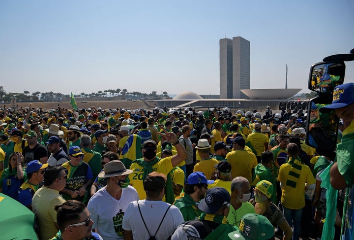 Jair Bolsonaro supporters rallied in front of Brazil's National Congress on Tuesday, in an attempt to demonstrate mass support for a president who has ramped up his attacks on the country's democratic institutions a year before its 2022 presidential elections. Some attendees made multiple attempts to barge past police barriers protecting the Congress and Supreme Court, according to news reports.