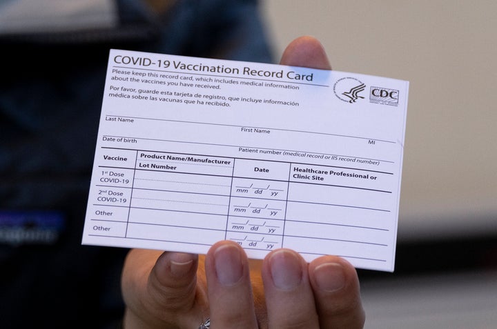 A COVID-19 vaccine card is pictured. Buying, selling or using a counterfeit COVID-19 vaccination card that features an o