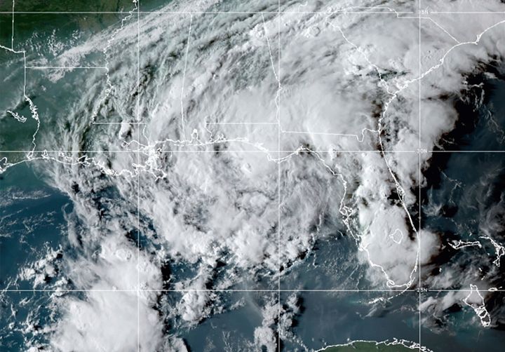 This GOES- East GeoColor satellite image taken Wednesday at 10:30 p.m. EDT. shows Tropical Storm Mindy as it makes landfall on the Florida Panhandle.