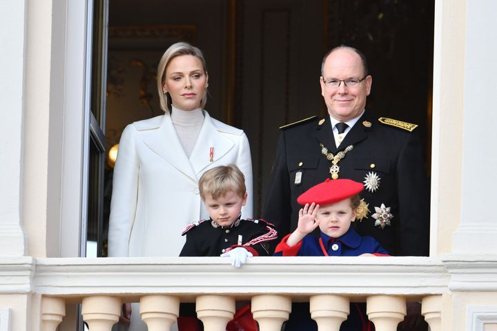 Princess Charlene and Prince Albert II of Monaco, with children Jacques and Gabriella, pose on the palace balcony during the Monaco National Day Celebrations in November 2019. 