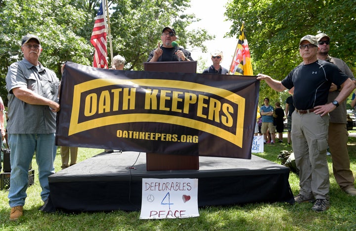 Stewart Rhodes, founder of the citizen militia group known as the Oath Keepers, center, speaks during a "rally against political violence" outside the White House on June 25, 2017. 