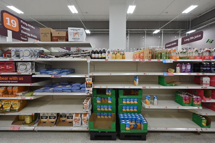 Empty shelves are pictured where cartons of fruit juice would be stocked inside a Sainsbury's supermarket in London on September 7, 2021.