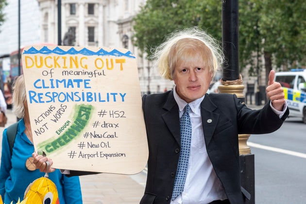 Extinction Rebellion protesters with a Boris Johnson
