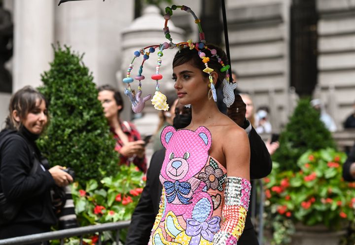 Taylor Hill is seen wearing baby mobile, as a headdress. 