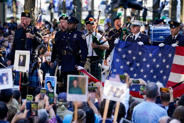 Members of the New York Police Department Pipes and Drums preform during a ceremony marking the 20th anniversary of the Sept. 11, 2001, terrorist attacks is held at the National September 11 Memorial and Museum in New York, Saturday, Sept. 11, 2021. (AP Photo/Evan Vucci)