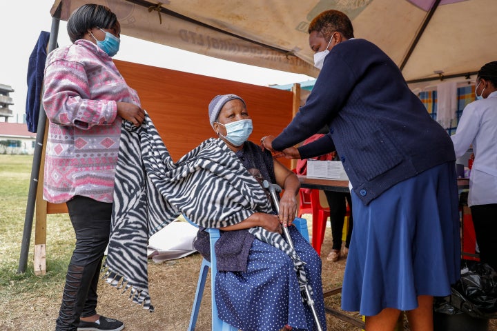 A woman receives the AstraZeneca coronavirus vaccine at Kenyatta National Hospital in Nairobi, Kenya, on Aug. 26.