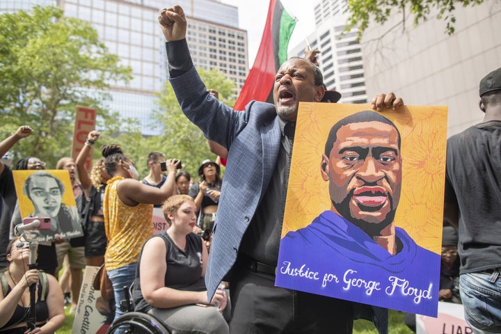 Community members listen the sentencing of former officer Derek Chauvin in Minneapolis, Minnesota, in June. Chauvin, Thomas Lane, J. Kueng and Tou Thao were arraigned in federal court on Tuesday.