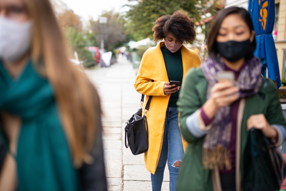 People commuting in the city wearing face