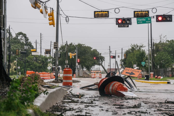 Debris and damaged road construction are left after Tropical Storm Nicholas moved through the Houston area Tuesday. 