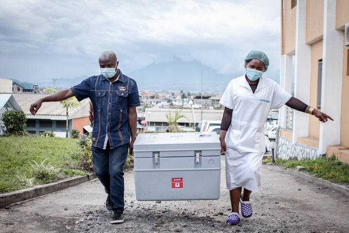 A health worker walks through the courtyard during a COVID-19 vaccination campaign on May 5 in Goma, Democratic Republic of C