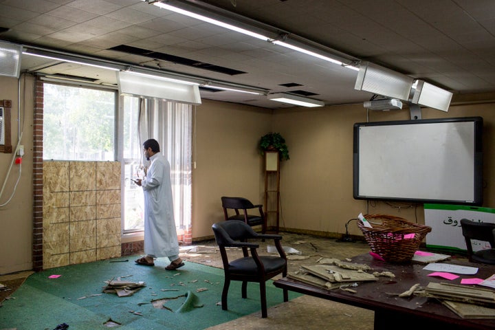 In this Aug. 7, 2017, file photo, Asad Zaman stands at the site of the bombing in the Dar Al Farooq Islamic Center in Bloomington, Minn. The leader of an Illinois anti-government militia group who authorities say masterminded the 2017 bombing of a Minnesota mosque is to be sentenced Sept. 13, 2021, for several civil rights and hate crimes in an attack that terrified a community.