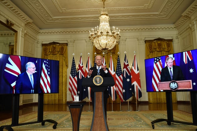 US president Joe Biden participates is a virtual press conference on national security with British prime...