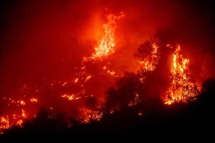 Flames from the KNP Complex Fire burn a hillside above the Kaweah River in Sequoia National Park. 