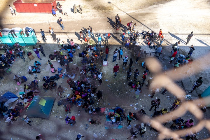 Migrants, mostly from Haiti, gather at a makeshift encampment under an overpass on the border between Del Rio, Texas, and Acuña, Mexico, on Sept. 17.