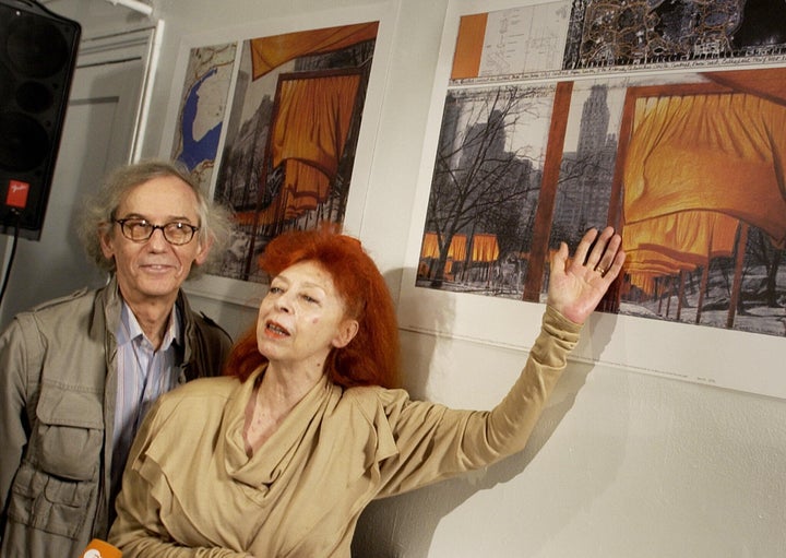 Christo (L) and his wife Jeanne-Claude (R) announce details of their collaborative project, "The Gates, Central Park, New York City, 1979-2005", in 2004.