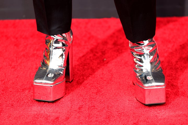 Bowen Yang wore silver platform heels by Syro.