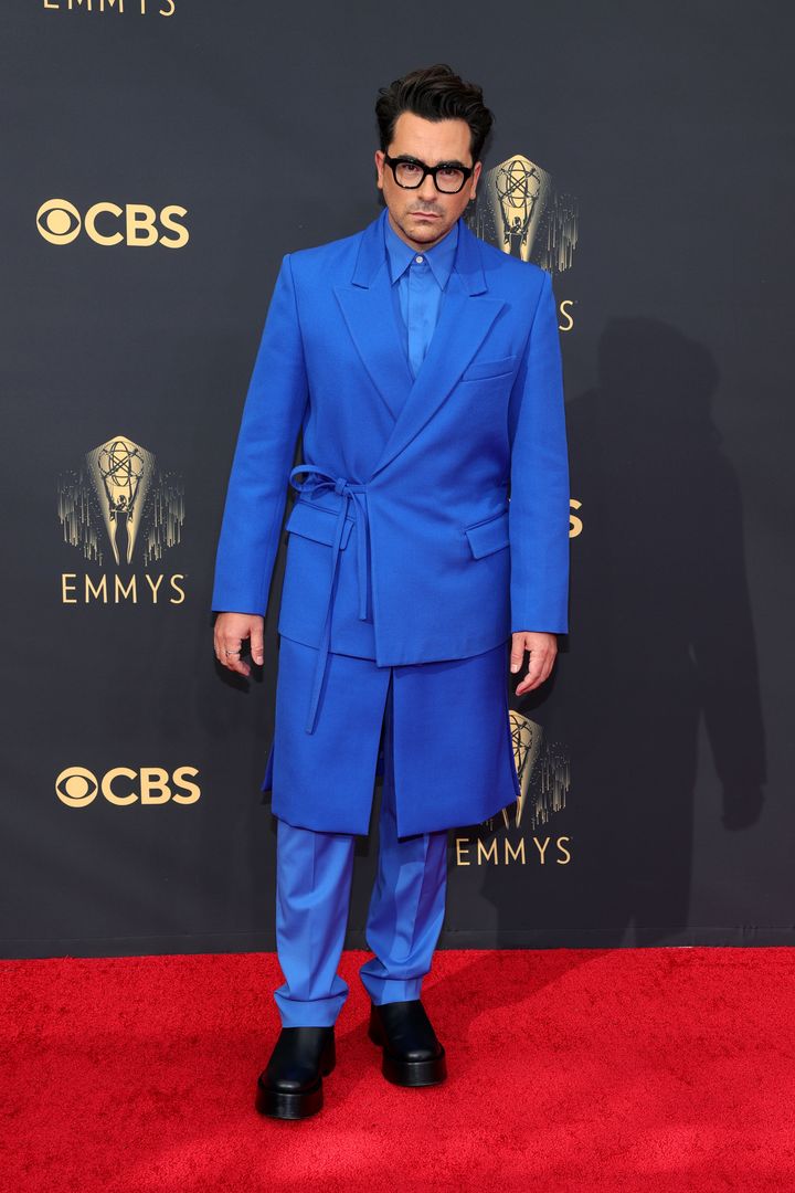 Daniel Levy ties up a new twist on the tux as he walks the red carpet before the 73rd Primetime Emmy Awards at L.A. Live on Sunday in Los Angeles.