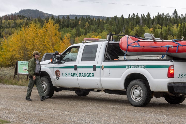 A park ranger speaks with a colleague on the road to Spread Creek Campground on Sunday near Moran, Wyoming. Law enforcement searching the area for Petito found a body believed to be the missing 22-year-old. 