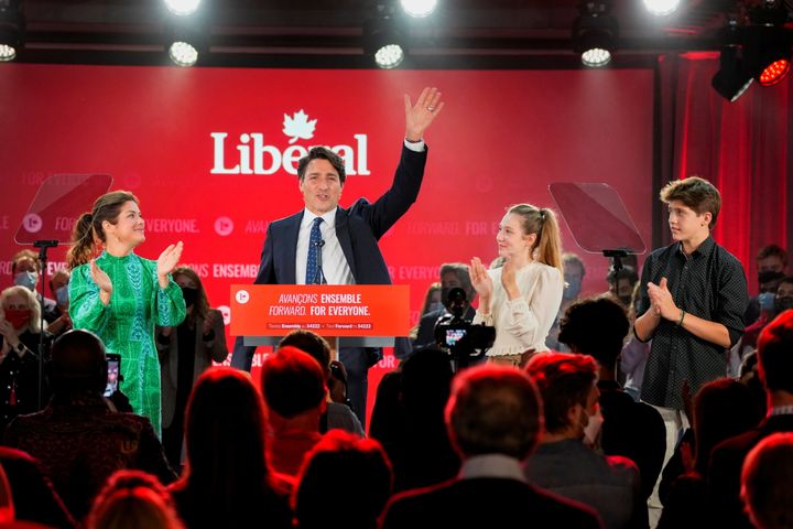Canada's Liberal Prime Minister Justin Trudeau, accompanied by his wife Sophie Gregoire and his children Ella-Grace and Xavier, waves to supporters during the Liberal election night party in Montreal on Monday.