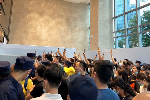 Chinese citizens demand the repayment of their loans or financial products in front of the headquarters ...