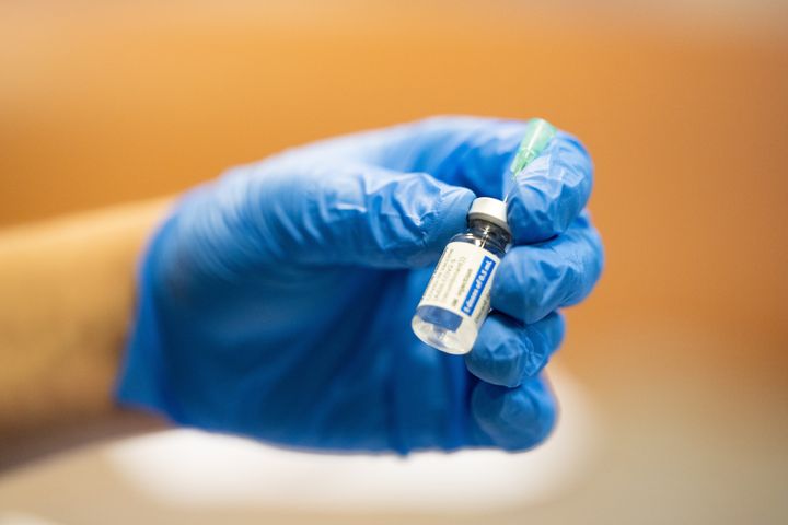 A syringe of the single-dose Johnson and Johnson vaccine is prepared. The drugmaker has released data showing that a booster dose produced an increased antibody response in adults from age 18 to 55. 