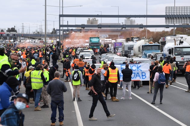 Construction workers and far right activists protest against Covid