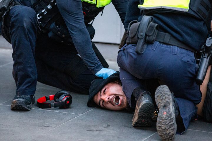 Victoria police arrest a protester during an anti vaccine protest on September 21, 2021