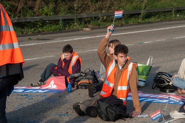 Protestors from Insulate Britain block the M25 motorway near Cobham in