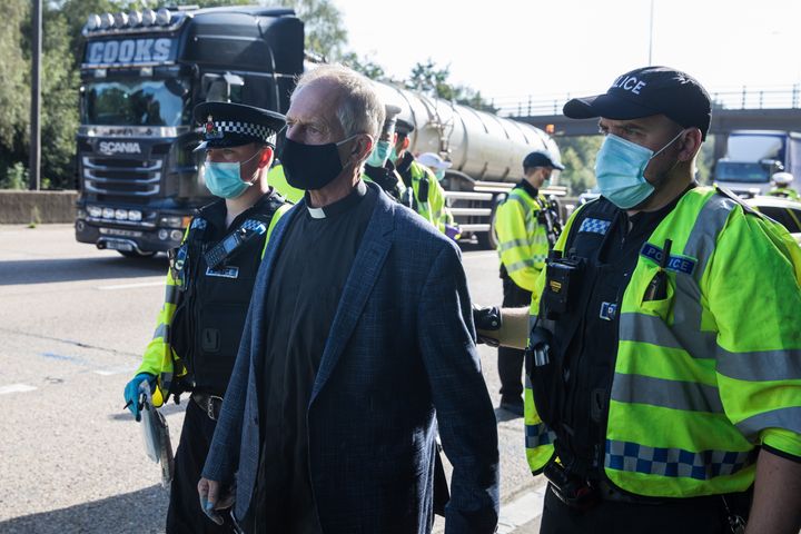 Insulate Britain climate activist Reverend Tim Hewes is arrested by Surrey Police.