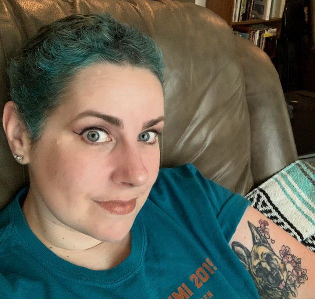 The author dyed her hair teal as it grew out after chemotherapy.