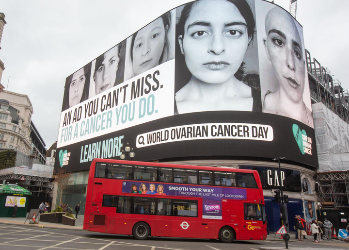 The author, second from left, appears on a billboard at Piccadilly Circus in London on World Ovarian Cancer Day 2021, next to 