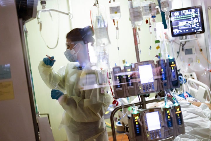 In this Aug. 31, 2021, file photo, Ann Enderle R.N. attends to a COVID-19 patient in the Medical Intensive care unit (MICU) a