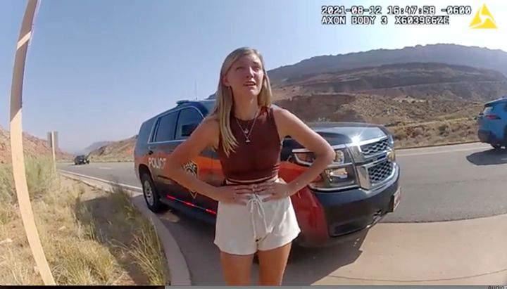 This image provided by Utah's Moab Police Department shows Gabby Petito talking to an officer after police pulled over the van she was traveling in with her boyfriend, Brian Laundrie, near the entrance to Arches National Park on Aug. 12.