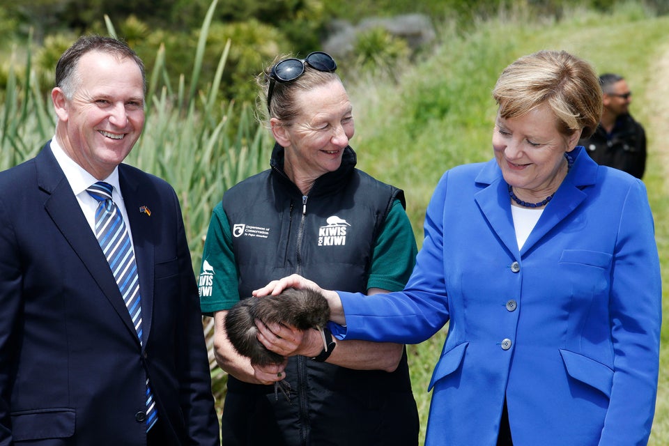  Merkel pets a native Kiwi named Whau in