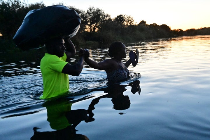 Haitian migrants cross the Rio Grande at the Mexico-U.S. border near Ciudad Acuna in Mexico — across the Rio Grande from Del Rio, Texas — on Thursday.