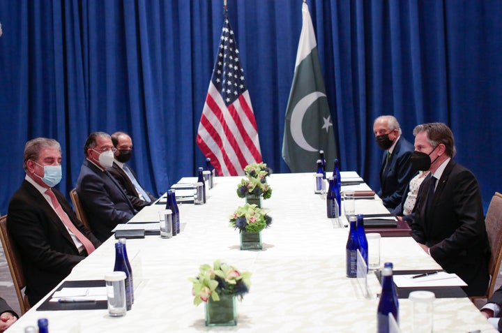 Pakistani Foreign Minister Shah Mahmood Qureshi, left, meets with U.S. Secretary of State Antony Blinken, right, on the sidel