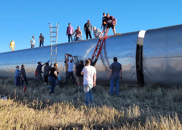 People work at the scene of an Amtrak train derailment on Saturday in north-central Montana. Multiple people were injured when the train that runs between Seattle and Chicago derailed Saturday, the train agency said.