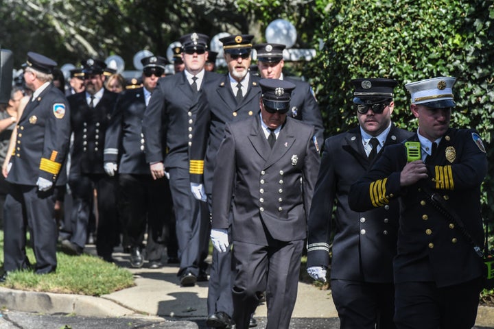 First responders gather at a funeral home to pay respects to the 22-year-old during a public funeral in her hometown of Long Island.