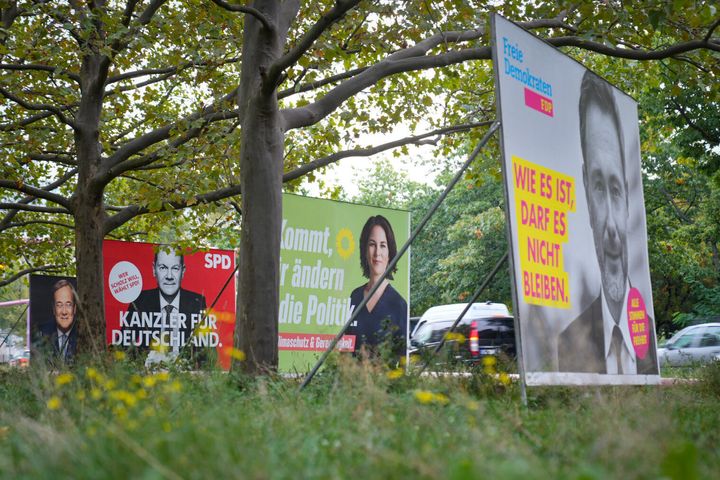 From left to right, election posters of the CDU/CSU with Armin Laschet, the SPD with Olaf Scholz, Bündnis 90/Die Grünen with Annalena Baerbock and the FDP with Christian Lindner are lined up in Berlin one day after the Bundestag elections.